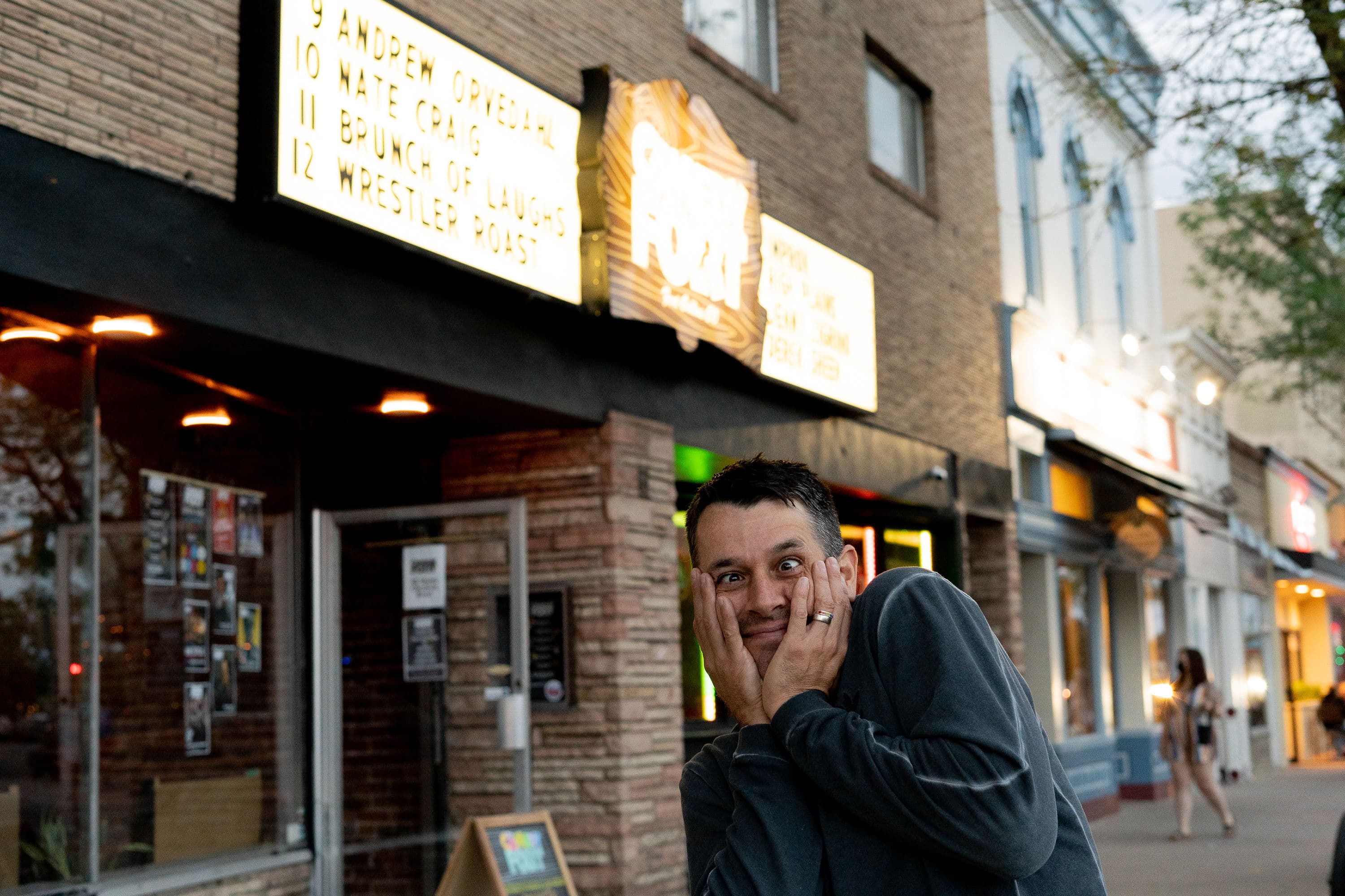 Nate Craig with crossed eyes outside of marquee